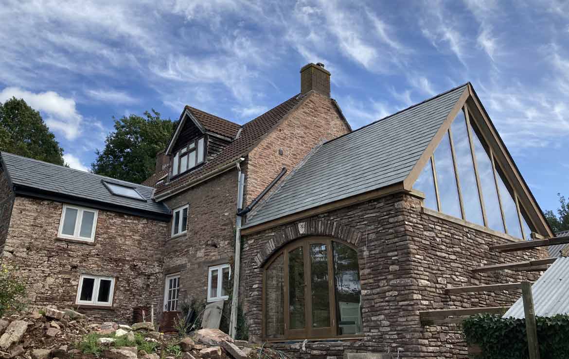 Rebuilt Stone Room with an Oak roof & glazed gable by Deanoak Limited